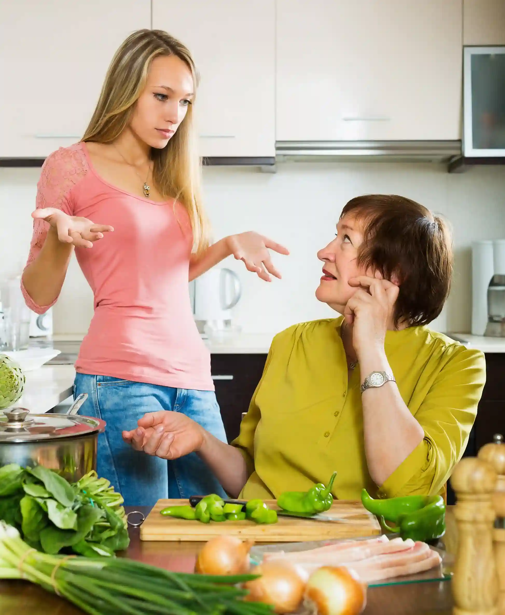 Two women discussing heart-healthy meal preparation and lifestyle changes for low cholesterol.